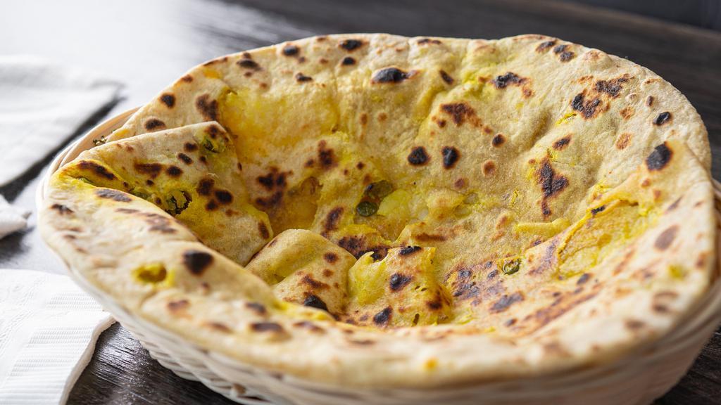 Aloo Paratha · Delicious clay baked flour stuffed with spiced potatoes.