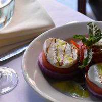 Caprese · Fresh mozzarella cheese, vine ripened beefsteak tomatoes, roasted peppers, and garlic with a...