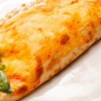 Calzone · Folded brick oven pizza stuffed with mozzarella, ricotta, and parmigiana cheese.