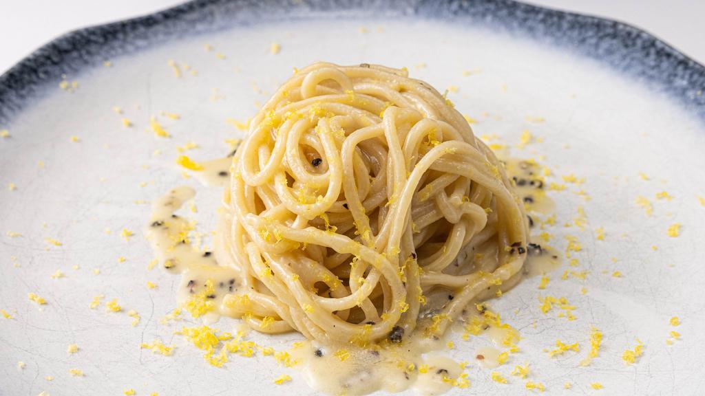 Bucatini Cacio E Pepe · Pasta with cracked black pepper with mix of pecorino and Parmigiano cheese in a butter sauce.