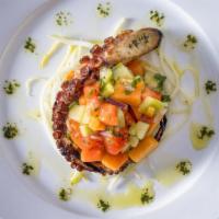 Grilled Portuguese Octopus · With green and ripe papaya salad, cucumber, red onion, and cilantro.