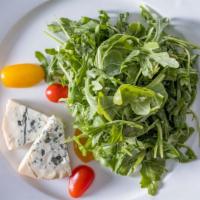 Baby Arugula Salad · With stilton blue and sherry vinaigrette.