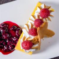 Passion Fruit Tart · With shortbread crust, fresh raspberries, and torched meringue.
