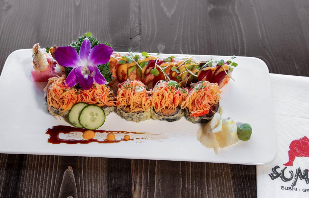 Volcano Roll · Deep-fried spicy tuna, avocado and cream cheese roll topped with spicy crab meat, tobiko, and scallions.