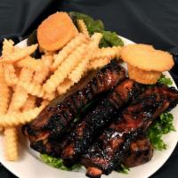 Spare Rib Dinner · Four large ribs, one side, and cornbread or dinner roll.