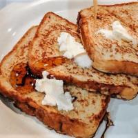 Golden Brown French Toast · with butter and syrup.