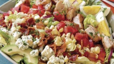 Cobb Salad · Served with strips of grilled chicken, bacon, Monterey Jack cheese, tomatoes, hard boiled egg and croutons.