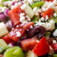 Greek Salad · Lettuce, tomato, onion, olives, green peppers and anchovies topped with feta cheese and vina...
