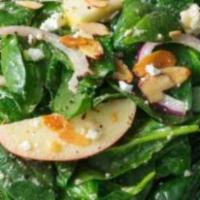 Spinach Salad · Fresh spinach leaves with sliced raw mushrooms, bacon bits and croutons.