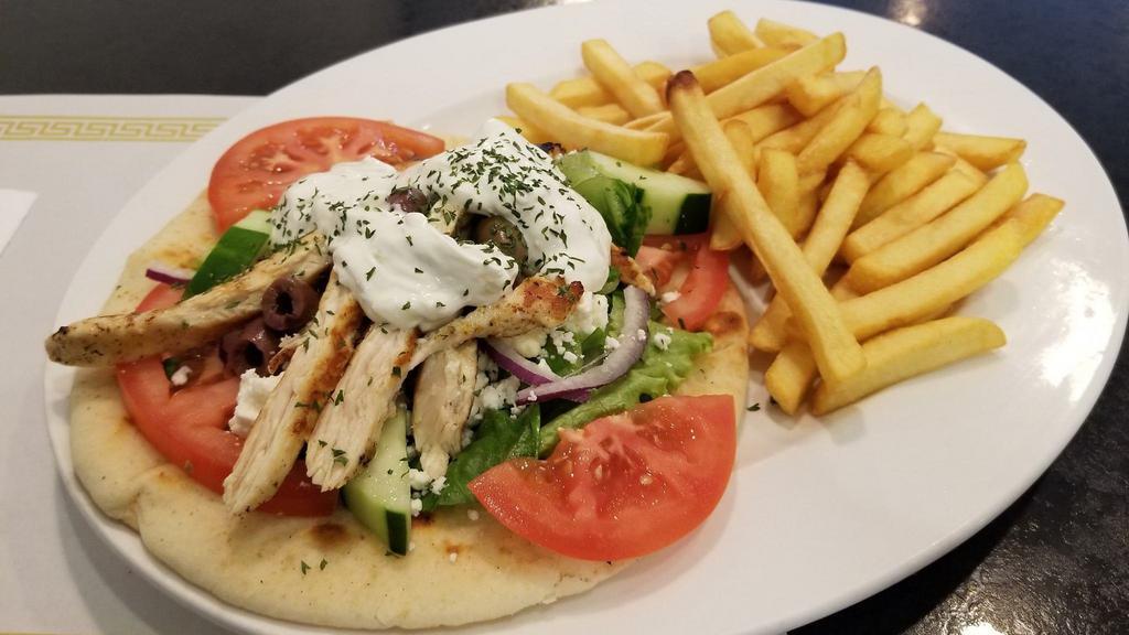 Chicken Souvlaki · Served with a small Greek salad and your choice of side.