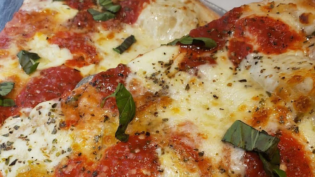 Margarita Pizza · Fresh mozzarella cheese, fresh basil, and homemade tomato sauce.