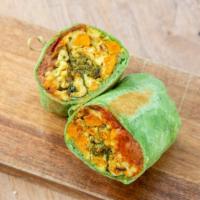 Vegetarian Burrito · Scrambled eggs, refried beans, chihuahua cheese, roasted sweet potatoes and chilies on a spi...