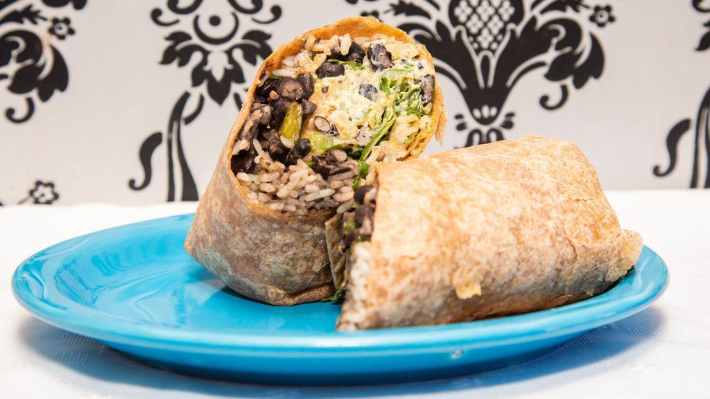 Si Wrap · Black beans, tri-color quinoa, peppers and onions, pico de gallo, avocado, cashew ricotta, seasonal greens, and cilantro lime sauce. Animal product free, gluten free (as a bowl),  soy free.