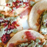Oto Taco · Roasted king oyster mushrooms, avocado, pico de gallo, sauerkraut, cashew ricotta, and cilan...