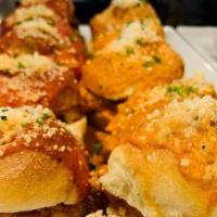 Enzo Chicken Parm Knot Slider (1 Each) · Homemade garlic knot chicken parmigiana sliders in our homemade vodka or tomato sauce