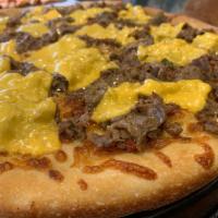 Philly Cheese Steak Pizzetta · Shreaded Steak/Sauteed Onions/American Cheese