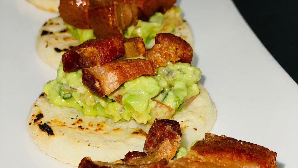 Arepas · With guacamole and pork belly or hogao