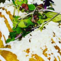 Empanadas (2 Per Order) · Chicken tinga, topped with sour cream and queso fresco. Slow cooker shredded beef served wit...