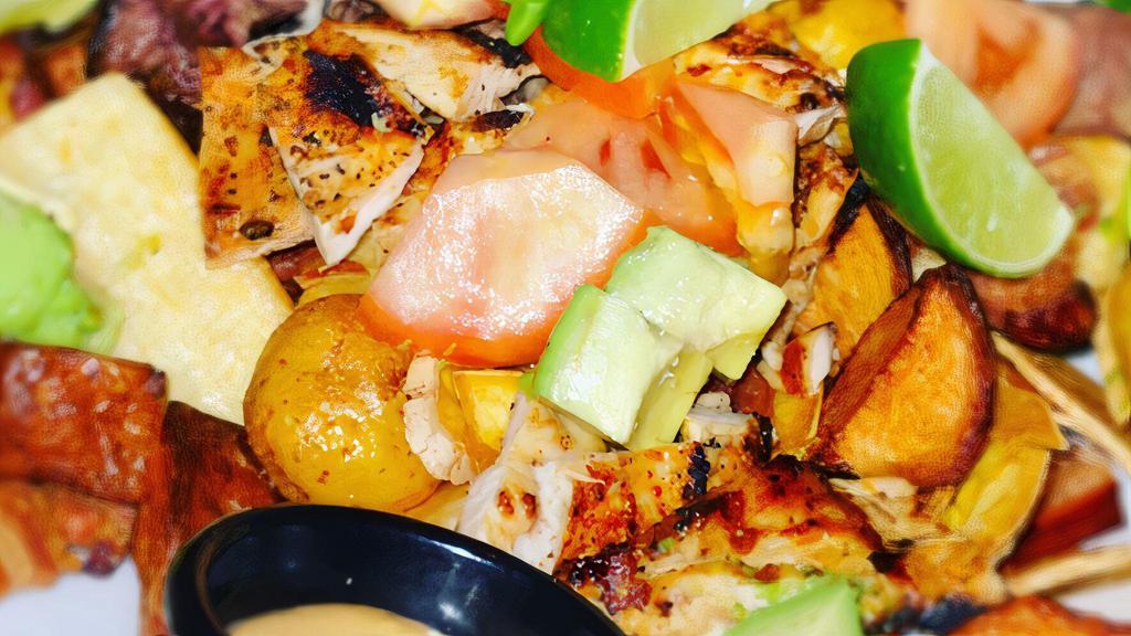 Picada · Authentic Colombian platter with hanger steak, chicken, chorizo, chicharron, green plantains, cassava, avocado, potatoes and tomatoes.