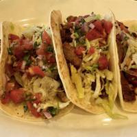 Steak Tacos Al Pastor · (3) soft corn tortillas stuffed w/ your choice of meat, white onions, cilantro and pineapple...