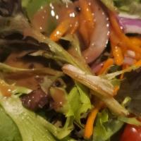 House Salad · Mixed greens, grape tomatoes, red onions, shaved carrots, cucumbers, balsamic vinaigrette dr...