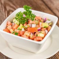 Coban Salata · Chopped tomatoes, cucumbers, onion, parsley tossed with olive oil, vinegar and lemon. Add ch...