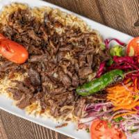Doner Platter · Turkish style gyro meat slowly cooked on a vertical spit.