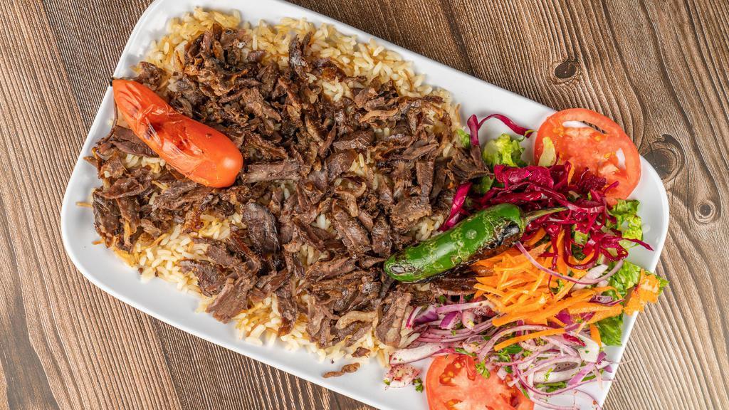 Doner Platter · Turkish style gyro meat slowly cooked on a vertical spit.
