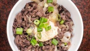 Sp2 Marinated Beef & Onion Over Rice With Egg & Sesame Seeds · 