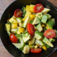 Mango Avocado Salad · Spring mix salad with mango, avocado, cucumbers, tomatoes, and citrus ponzu