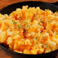 Truffle Mac And Cheese · Macaroni prepared with freshly made cheese sauce, beurre noisette, bread crumbs and white tr...