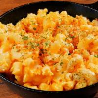 Mac And Cheese · Macaroni prepared with freshly made cheese sauce, and bread crumbs