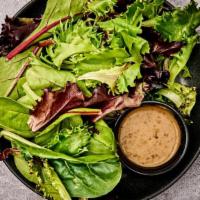 Side Salad · Spring mix with roasted sesame dressing.