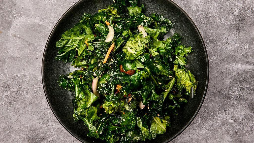 Side Of Sesame Kale Salad · Curly kale with carrots, red onions, and sesame seeds dressed with a sesame vinaigrette