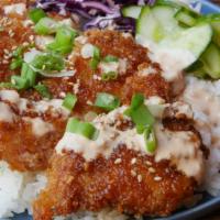 Crispy Chicken Bowl · Crispy panko chicken with cabbage slaw, cucumbers, and choice of base.