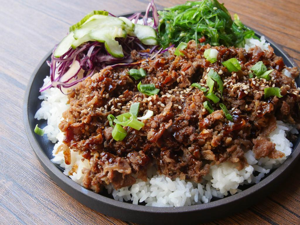 Bulgogi Beef Bowl · Thinly sliced marinated ribeye beef with cabbage slaw, cucumbers, and choice of base.