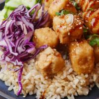 Crispy Glazed Tofu Bowl · Olive oil fried tofu seasoned with five spice with cabbage slaw, cucumbers, and choice of ba...
