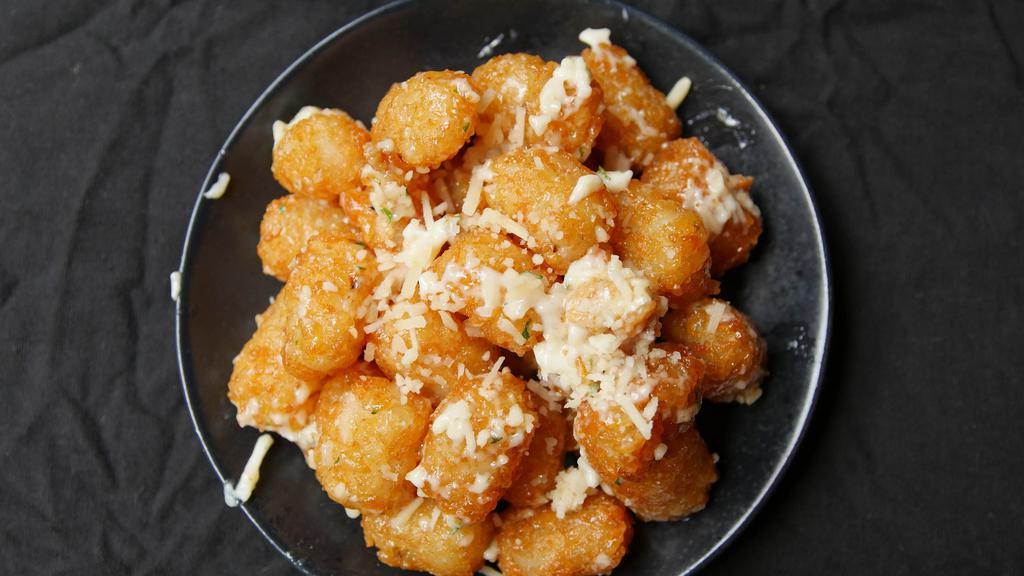 Truffle Parmesan Tots · Tater tots with fresh parmesan cheese and white truffle oil