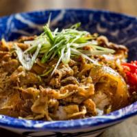 Sukiyaki Beef Rice Bowl · Rice bowl topped with beef and onion simmered in a mildly sweet sauce and red ginger pickles.