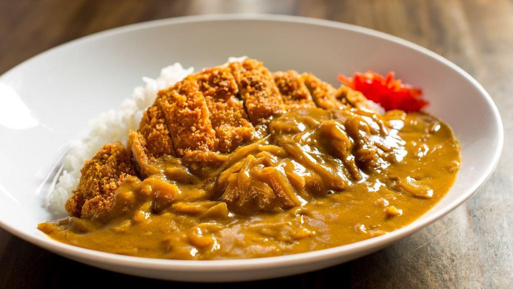 Pork Cutlet Curry · Rice bowl topped with breaded pork loin and onion curry.