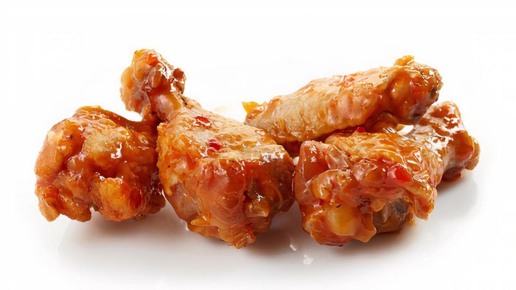 The Sweet N' Chili Wings · Chicken wings fried to golden perfection, topped with Sweet N' Chili sauce.