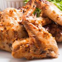 The Honey Mustard Wings · Chicken wings fried to golden perfection, topped with Honey Mustard sauce.
