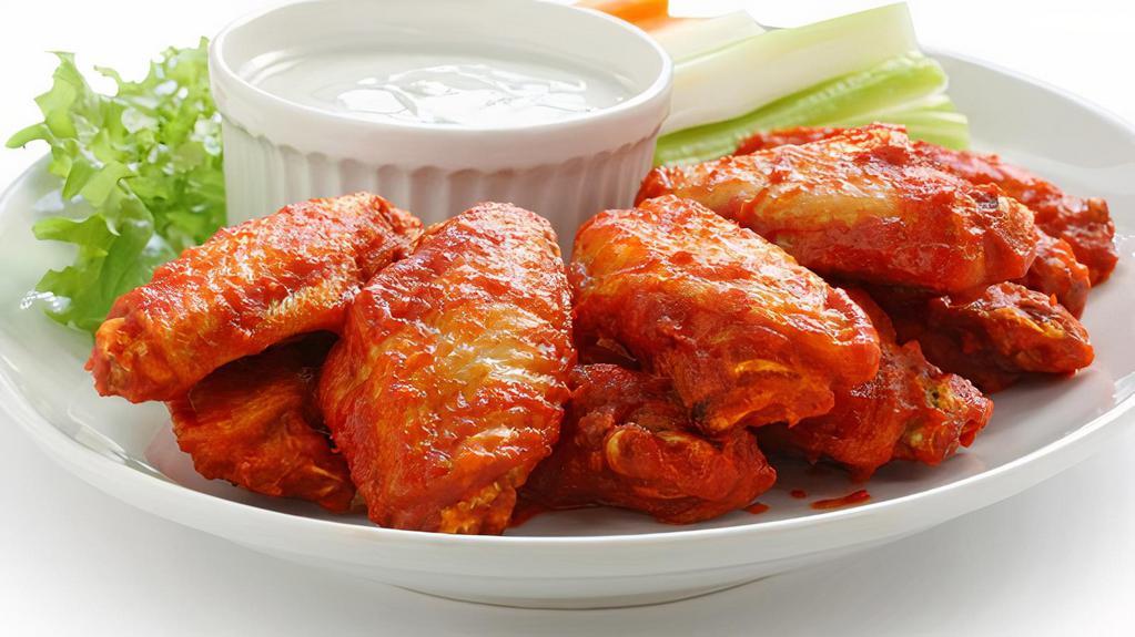 The Ranch Wings · Chicken wings fried to golden perfection, topped with Ranch sauce.