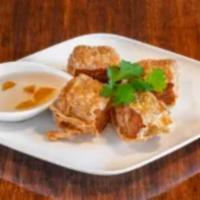 Hoi Jor · Deep-fried tofu skin stuffed with crabmeat and ground pork with plum sauce.