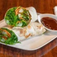 Duck Wrap · Roasted duck, carrot, cucumber, scallion wrapped in tortilla skin with Peking sauce.