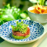 Tuna Tartare · A beautiful section of tuna loin that is large diced, uniformly, lathered with a soy sauce m...