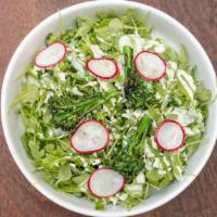 Arugula Salad · Farmers arugula dressed in a japanese inspired green goddess dressing, made from shiso. Cris...