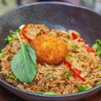 Basil Fried Rice · Fried Rice flavored with fresh Thai basil,  scallions and sauce made with soy. Topped with a...
