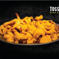 Cheese Fries · Signature curly fries tossed with nacho cheese!
