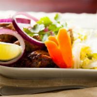 Chicken Shish Kebab · Minced chicken marinated with spices and cooked on skewers in clay oven.
